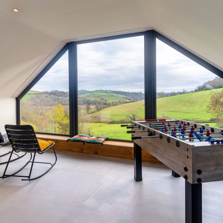 Tbale football, chairs and games room with view