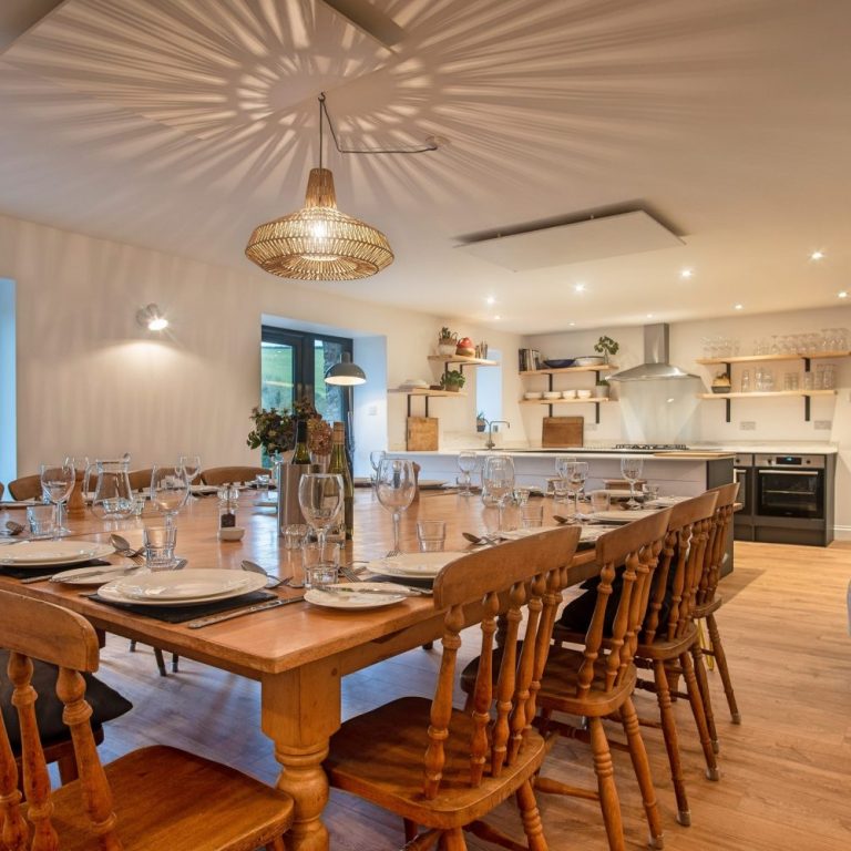Dining table and kitchen beyond