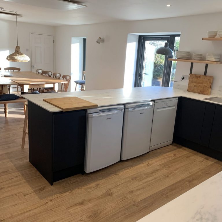 Kitchen showing fridges and dishwasher